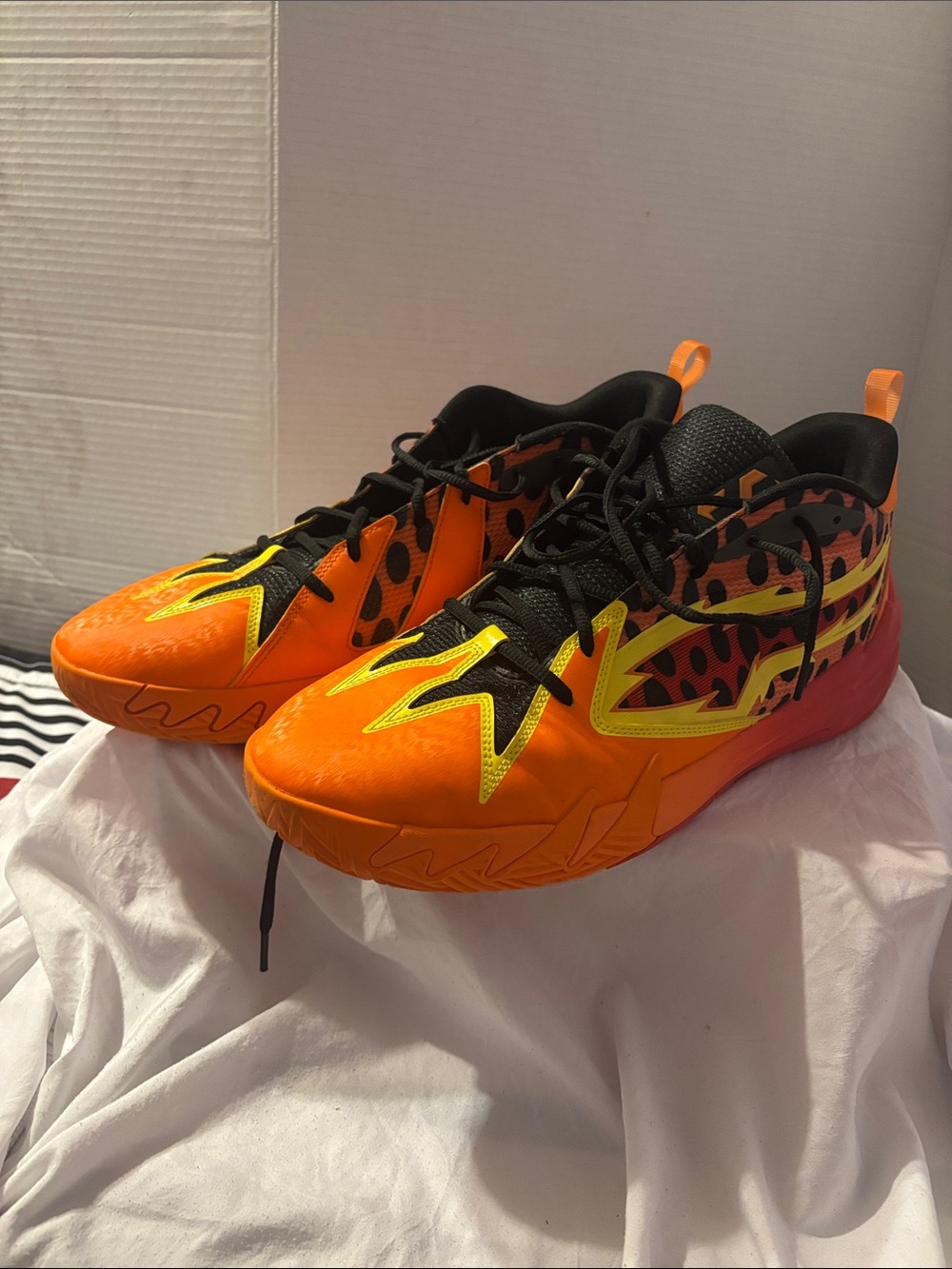 Puma Youth Orange and Black Athletic Sneakers with Yellow Accents